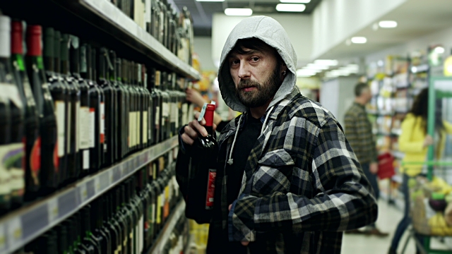 Bearded men shoplifting in supermarket