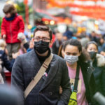 People wearing a face masks to protecting themself because of epidemic in China. Selective Focus. Concept of coronavirus quarantine.